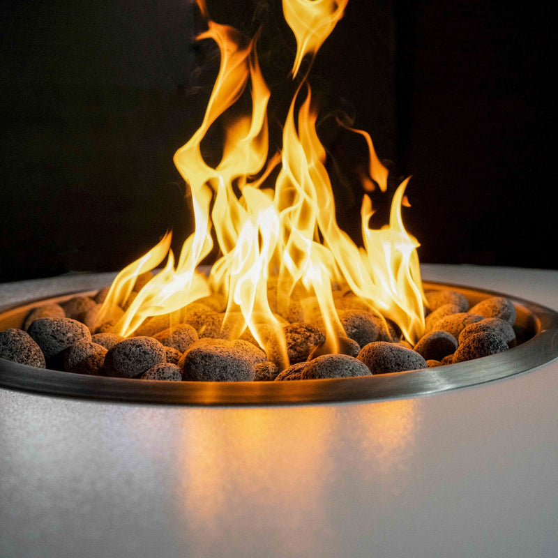 42" Gray Powder Coated Metal Liquid Propane Fire Pit with 12V Electronic Ignition, accompanied by the Isla Gravity Lounge Chair